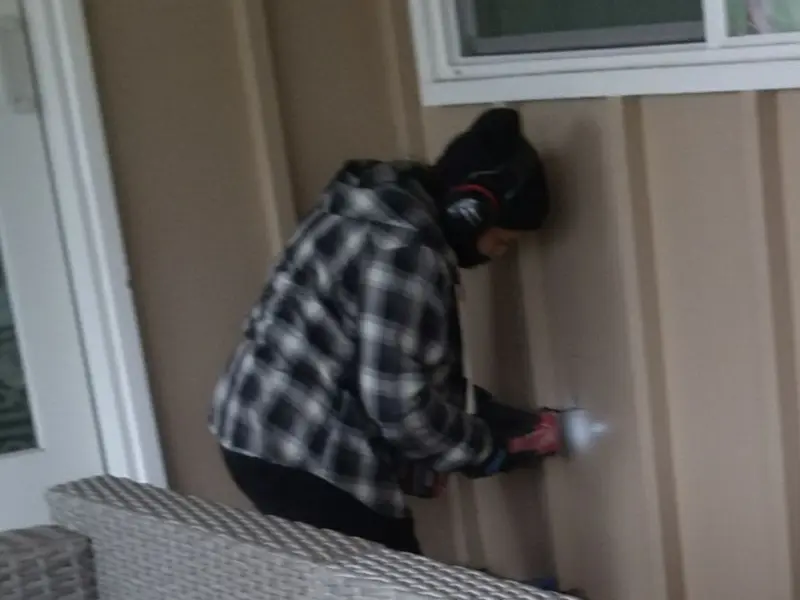 Professional electrician installing an exterior outlet in Little Silver