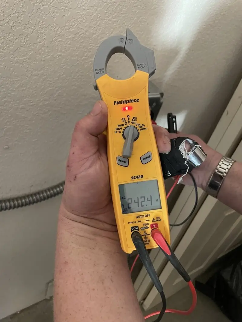 Voltage testing with clamp meter during Ceiling Fan Installation in Little Silver